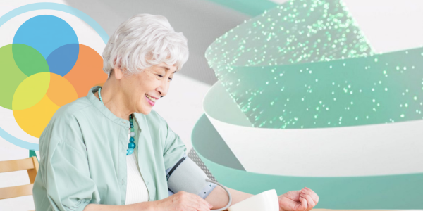 An elderly woman using a blood pressure machine with the background logos of Life365 and Microsoft Fabric
