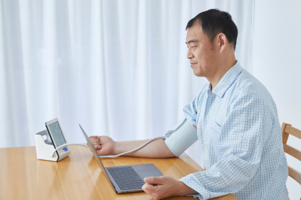 Individual taking blood pressure readings